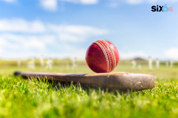 bat and ball placed in a grassland for the start of cricket betting